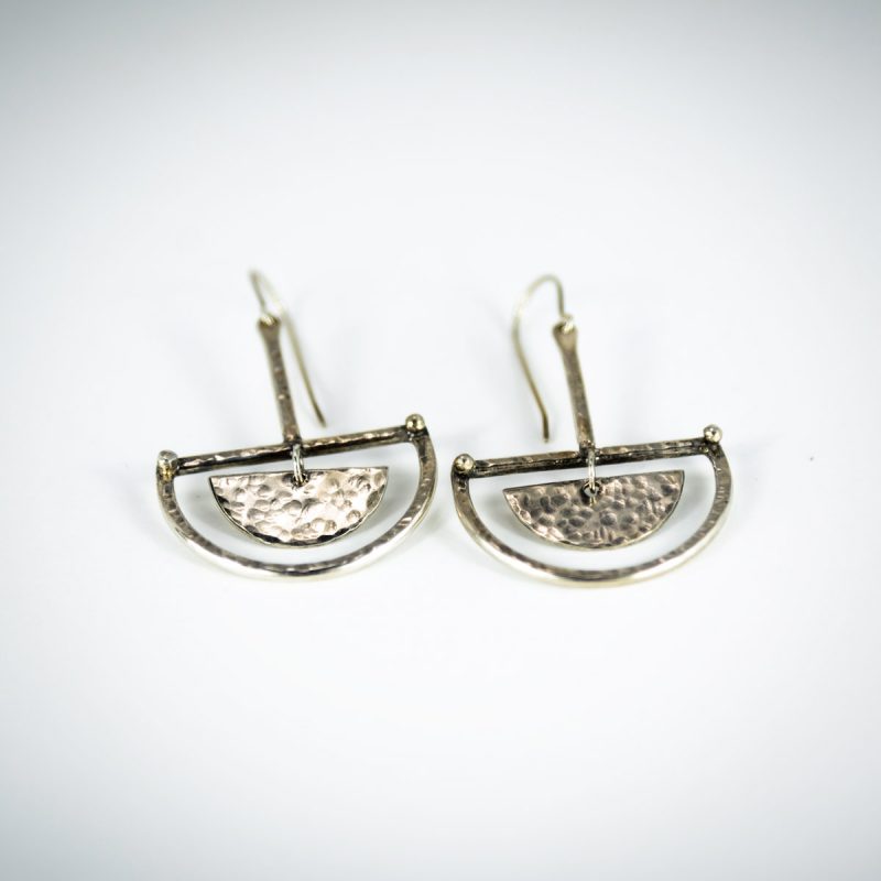 Dangling sterling silver earrings hand hammered, oxidized and finished with a luscious polishing.