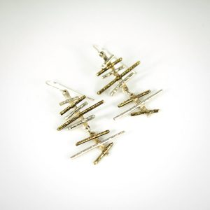 These saucy Haywired Silver and Brass Earrings love to dangle around! Oxidized creating a rich contrast between the silver and brass for a stunning look! Top view.