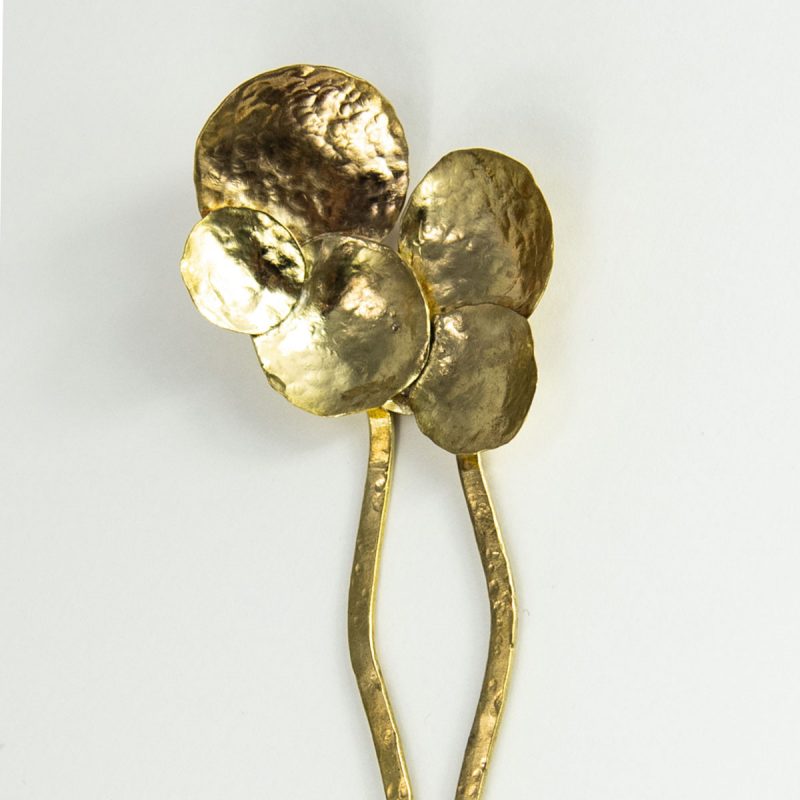 This stylish Brass Hair Fork Circle adds a bold artsy touch to a bun or any up-do hair styles.