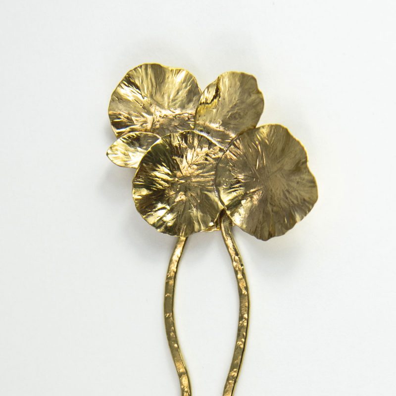 This stylish Brass Hair Fork Ikebana adds a bold artsy touch to a bun or any up-do hair styles.