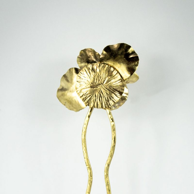 This stylish Brass Hair Fork Ikebana adds a bold artsy touch to a bun or any up-do hair styles. Back view.