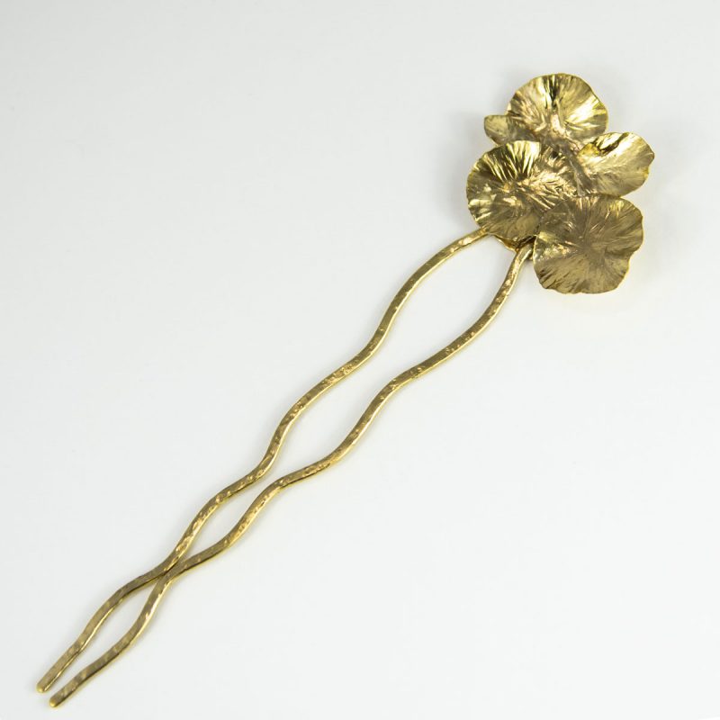 This stylish Brass Hair Fork Ikebana adds a bold artsy touch to a bun or any up-do hair styles. Top view.