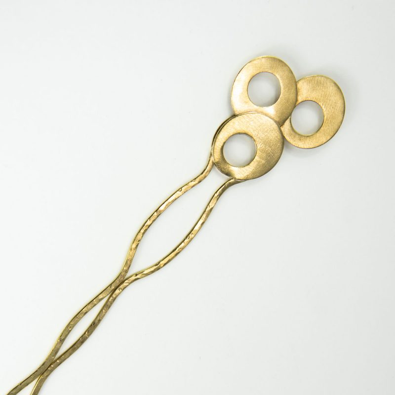 This stylish Brass Hair Fork Olives adds a bold artsy touch to a bun or any up-do hair styles. Made from lustrous brass, it is cut and forged by hand, soldered, textured, satin finish, durable and ready to be worn!